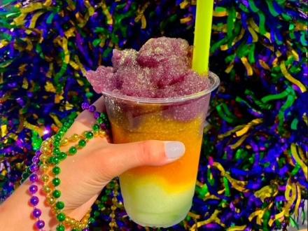 Colorful king cake daiquiri at High Tide Daiquiris & Mimosas in Gulf Shores