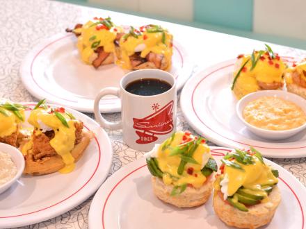 A table filled with plates of breakfast food at Sunliner Diner in Gulf Shores