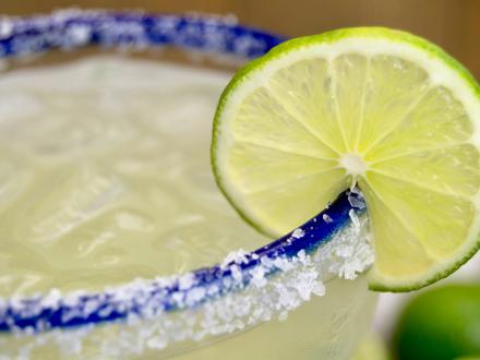 Lime margarita on the rocks with a salt rim