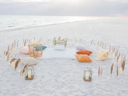 Beach picnic proposal on the shores of Orange Beach set up by Beachside Blankets
