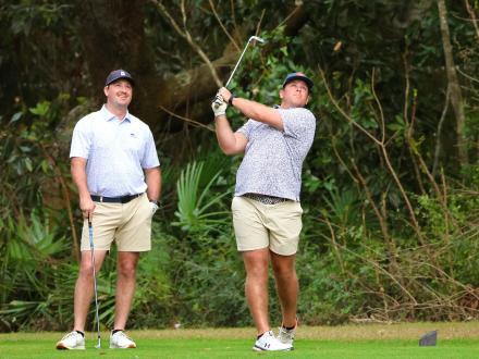 Men playing golf in Gulf shores