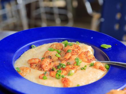 a bowl of shrimp and grits at Tacky Jacks waterfront restaurant