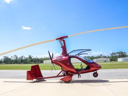 Bright red gyroplane at Magni Gyroflight, helicopter tour in Gulf Shores