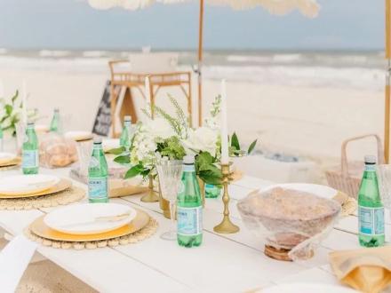 Picnic party from Southern Charm Co. on the beach in Gulf Shores