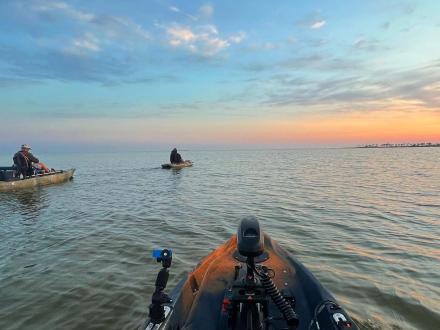 Scenic view from a kayak paddling through the waters at sunset on Alabama's Beaches