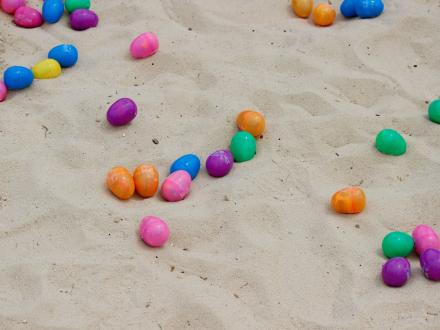 Colorful Easter eggs on the sand at LuLu's Annual Easter Egg Hunt in Gulf Shores