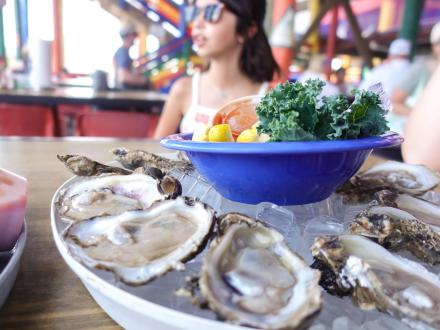 A dozen raw oysters sitting on the table at Tacky Jacks waterfront restaurant in Orange Beach