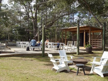 Outdoor dining area at Woodside restaurant in Gulf State Park
