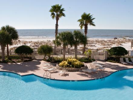 Scenic view of the beachfront pool at The Beach Club Resort in Fort Morgan