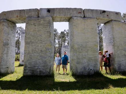 People admiring Bamahenge, Stonehenge replica at Barber Marina