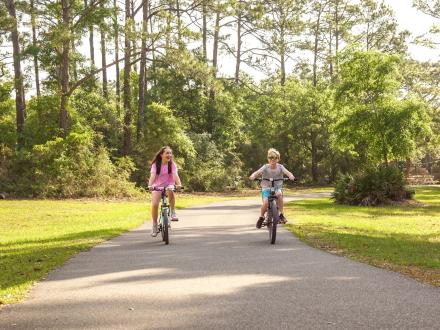 Kids biking along the trail in Gulf State Park