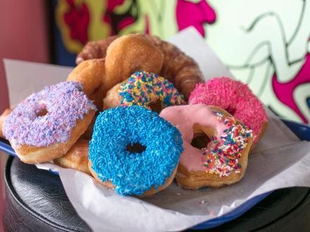 a plate of colorful donuts at City Donut in Orange Beach
