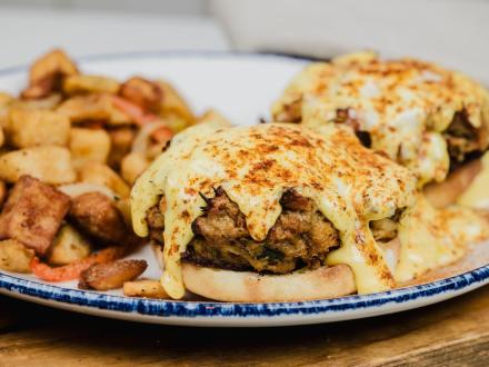 Plate of breakfast sandwich at Coastal brunch restaurant in Orange Beach