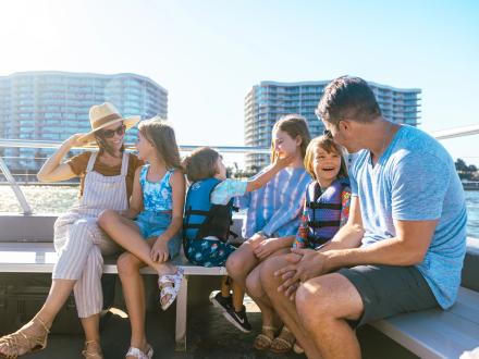 Family on a scenic dolphin cruise in the Gulf from Orange Beach