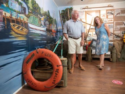 Couple walking through the displays at The Gulf Shores Museum