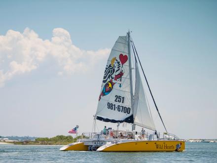 Sail Wild Hearts sailboat cruising through the Gulf in Orange Beach