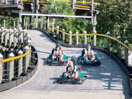 family racing go karts at The Track Family Fun Park in Gulf Shores