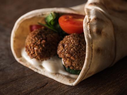 falafel pita wrap with tomatoes, lettuce, and taziki sauce