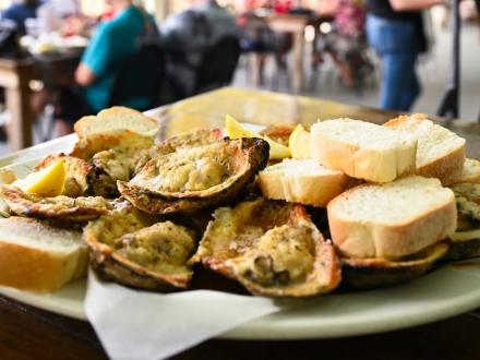 plate of chargrilled oysters and French bread at Acme Oyster House in Gulf Shores