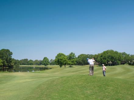 Golfers playing golf at Craft Farms, popular golf course in Gulf Shores