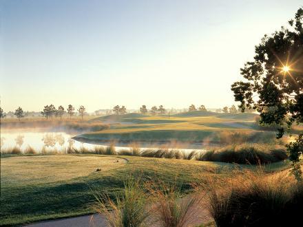 Beautiful sunrise over Craft Farms Golf Resort, award-winning golf course in Gulf Shores