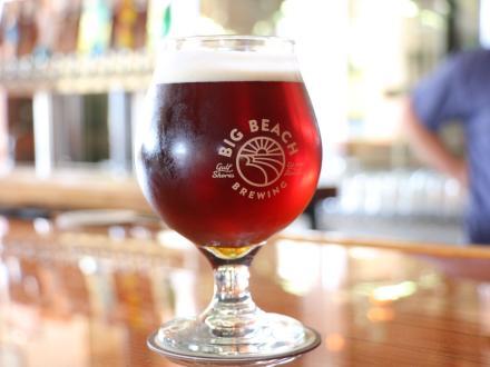 a glass pint of craft beer on the bar at Big Beach Brewing