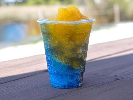 A yellow and blue frozen daiquiri at High Tide Daiquiris & Mimosas