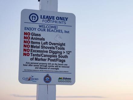 Leave Only Footprints sign on the beach in Gulf Shores