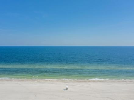 Scenic aerial view of the white sand beaches of Gulf Shores empty