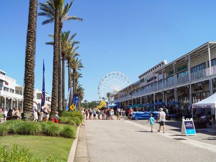 People attending an event at The Wharf entertainment district in Orange Beach