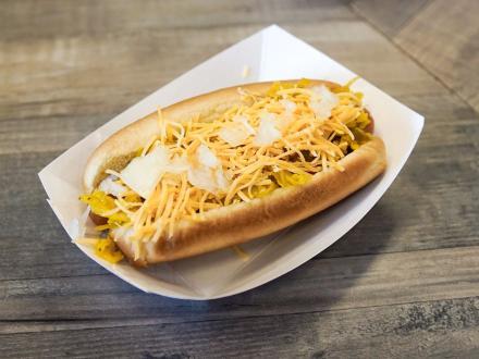 hotdog stacked with toppings at Wacked Out Weiner lunch restaurant in Gulf Shores