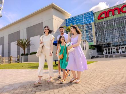 Family leaving AMC movie theater at The Wharf in Orange Beach