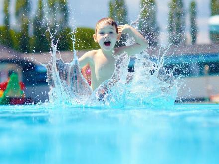 Kid splashing in the wave pool at Waterville USA Waterpark in Gulf Shores