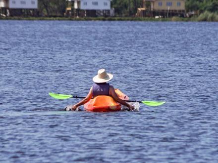 woman kayaking in Lake Shelby at Gulf State Park