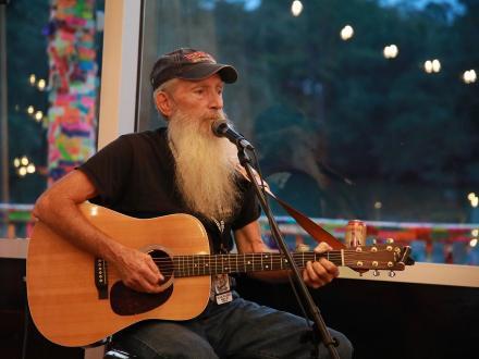 Musician performing live music at Tacky Jacks waterfront restaurant