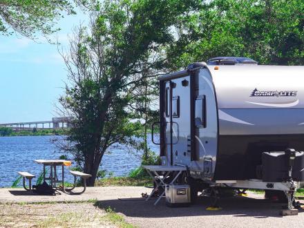 RV parked by Lake Shelby in Gulf State Park Campground in Gulf Shores