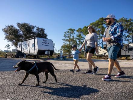 Family walking down along the grounds at Luxury RV Resort