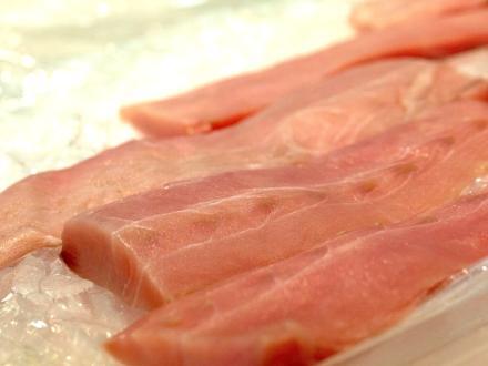 fresh fish filets sitting on ice at a seafood market in Gulf Shores