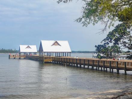 Fishing pier on Wolf Bay at scenic Waterfront Park in Orange Beach