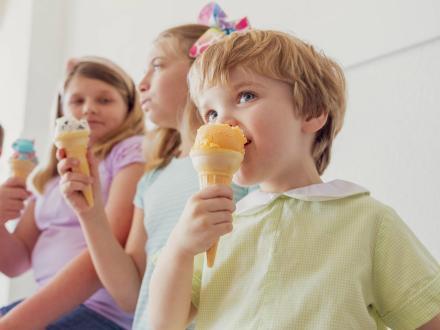 Kids enjoying ice cream cones at Del's Ice Cream, local ice cream shop in Orange Beach