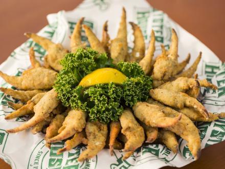 a plate of fresh fried crab claws at Original Oyster House seafood restaurant in Gulf Shores