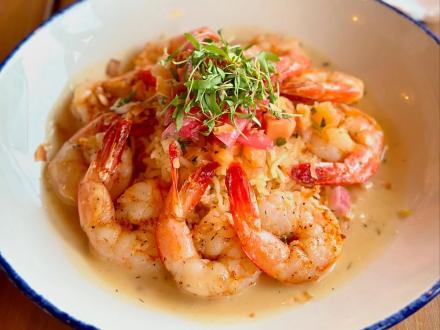 Tropical shrimp and rice entree at Coastal Orange Beach, waterfront seafood restaurant