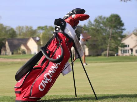 Bag of golf clubs on the greens at Craft Farms golf course in Gulf Shores