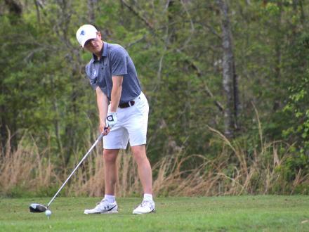Golfer winding up to hit a shot at Craft Farms golf course in Gulf Shores