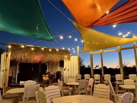 Open-air seating at Sassy Bass Cookout Tiki Bar, causal dinner restaurant in Fort Morgan