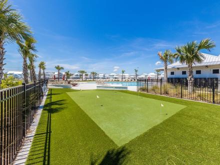 Putt putt green and pool area at Summersalt beach house community in Orange Beach
