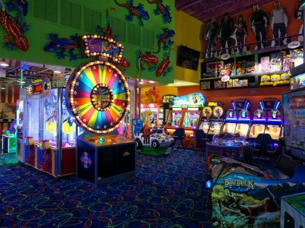 Room filled with classic and modern games at Fat Daddy's Arcade in Orange Beach