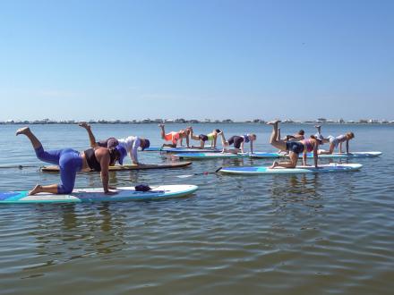 yoga paddleboarding in little lagoon with Glow Yoga and Aloha Pure Adventures