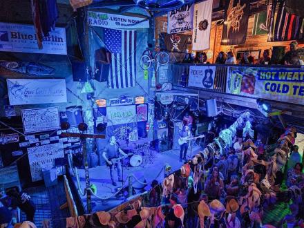 Crowd listening to live music at Flora-Bama Lounge & Oyster Bar in Orange Beach