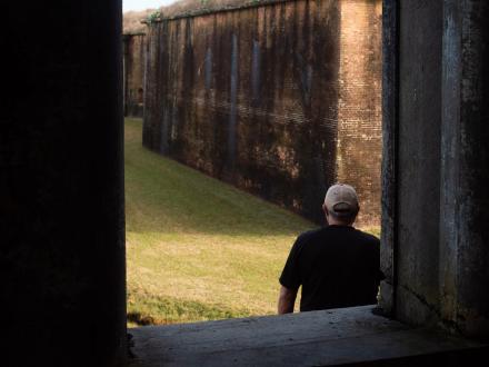 Man exploring Historic Fort Morgan site in Gulf Shores